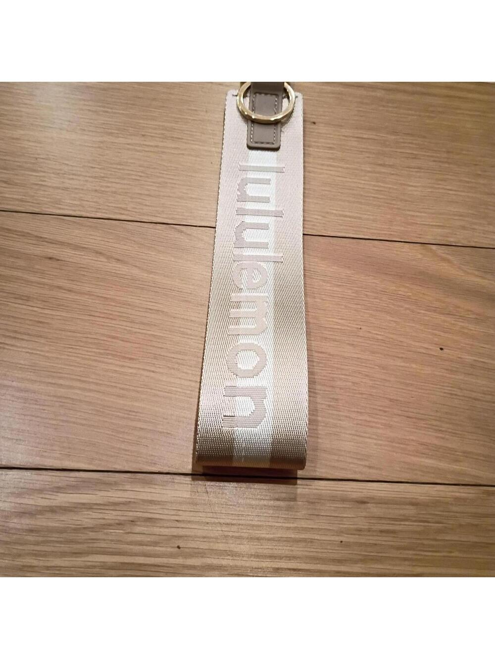 Women's Tan and Gold never lost keychain